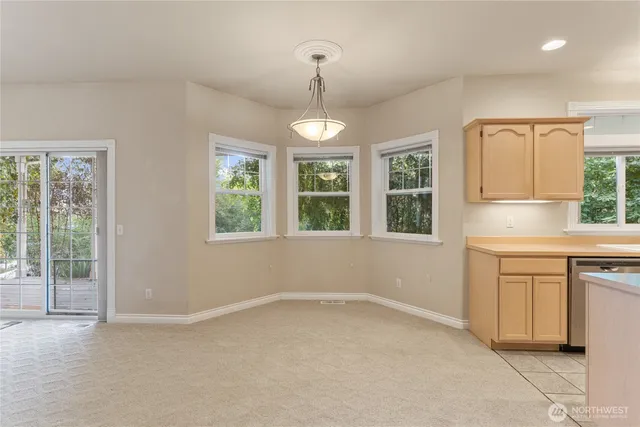 a kitchen with windows and sink