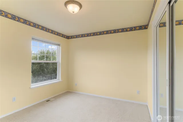 a view of a room with window and door