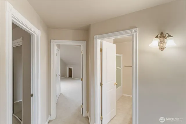 a view of a room that has a mirror in it