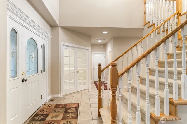 a view of an entryway with wooden floor