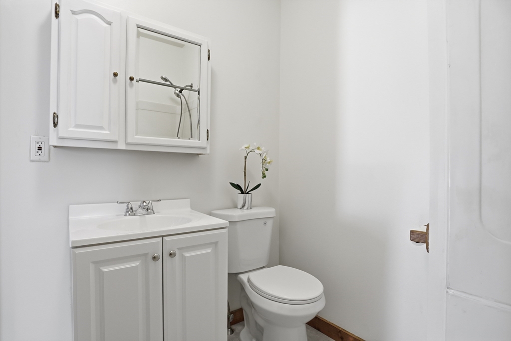 12 Whitcomb Street Webster, MA 01570 - Photo 13 of 40 a bathroom with a sink toilet and vanity