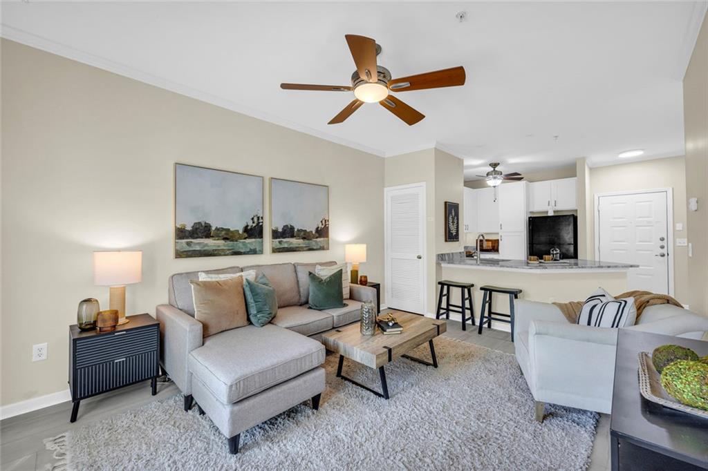 821 Ralph McGill Boulevard Northeast, Unit 3325 Atlanta, GA 30306 - Photo 1 of 54 a living room with furniture kitchen view and a chandelier