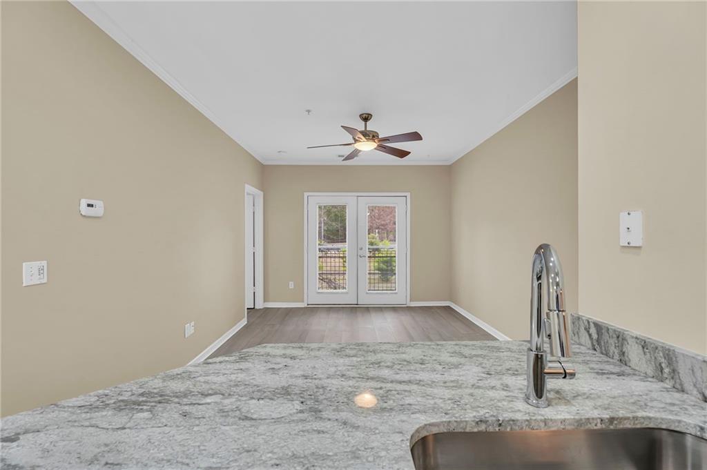821 Ralph McGill Boulevard Northeast, Unit 3325 Atlanta, GA 30306 - Photo 12 of 54 a view of a livingroom with a ceiling fan and window