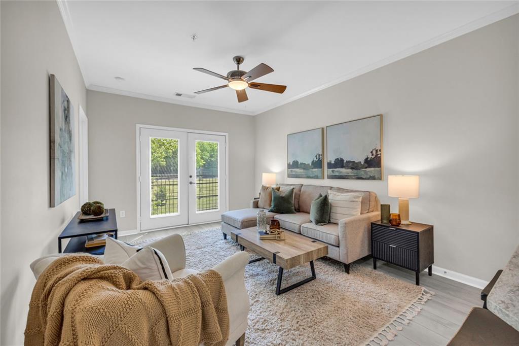 821 Ralph McGill Boulevard Northeast, Unit 3325 Atlanta, GA 30306 - Photo 13 of 54 a living room with furniture and a large window