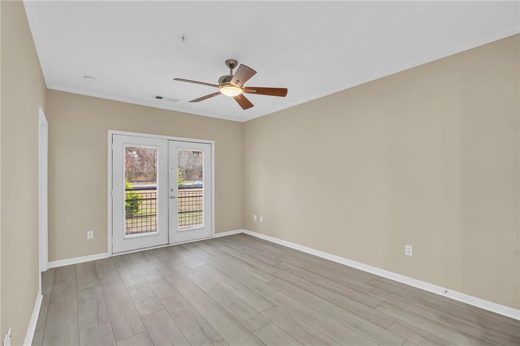 821 Ralph McGill Boulevard Northeast, Unit 3325 Atlanta, GA 30306 - Photo 14 of 54 a view of room with hardwood floor and ceiling fan