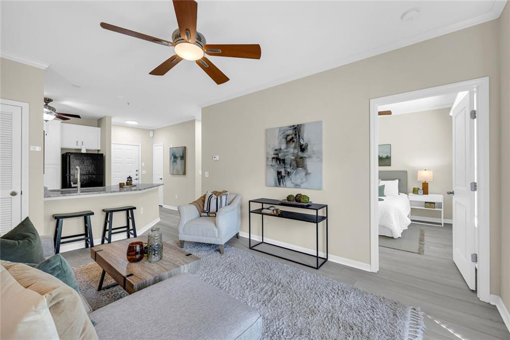 821 Ralph McGill Boulevard Northeast, Unit 3325 Atlanta, GA 30306 - Photo 17 of 54 a living room with furniture and a flat screen tv