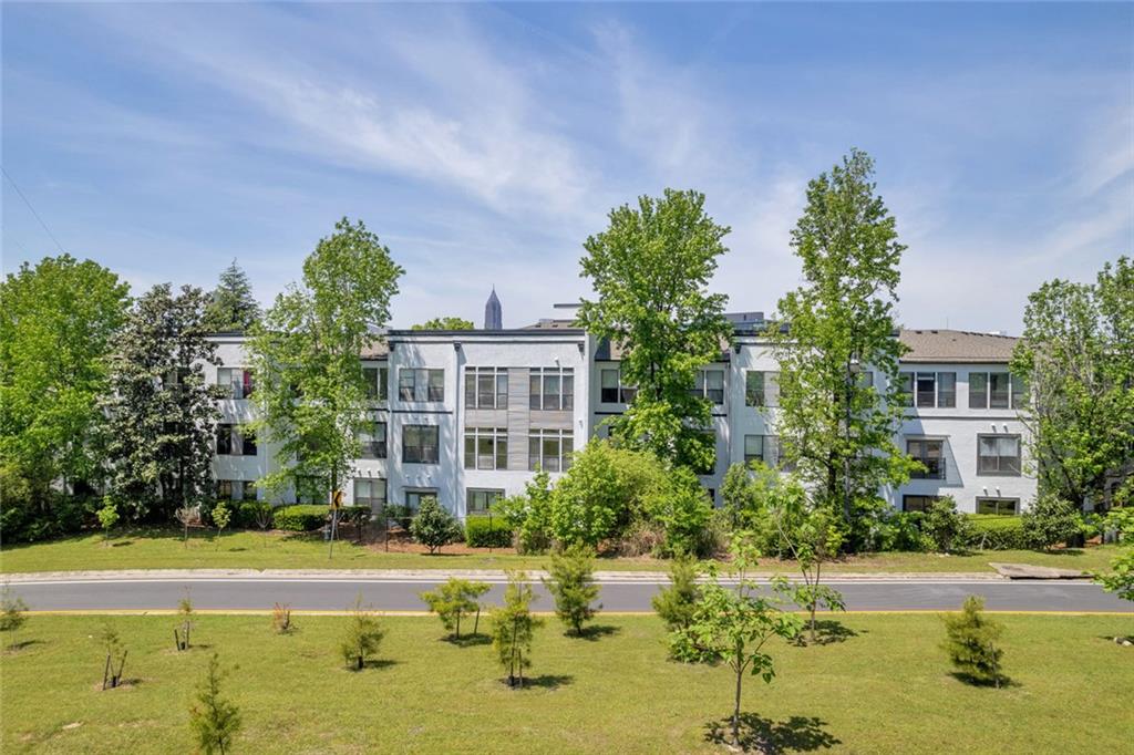 821 Ralph McGill Boulevard Northeast, Unit 3325 Atlanta, GA 30306 - Photo 2 of 54 a swimming pool with outdoor seating and yard