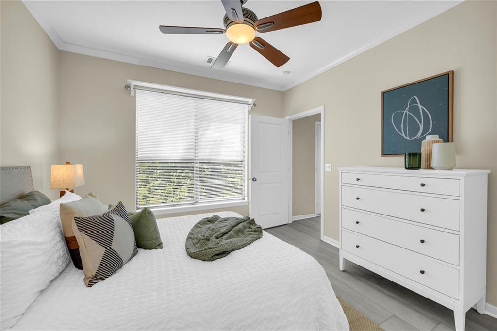 821 Ralph McGill Boulevard Northeast, Unit 3325 Atlanta, GA 30306 - Photo 3 of 54 a bedroom with a bed and a dresser