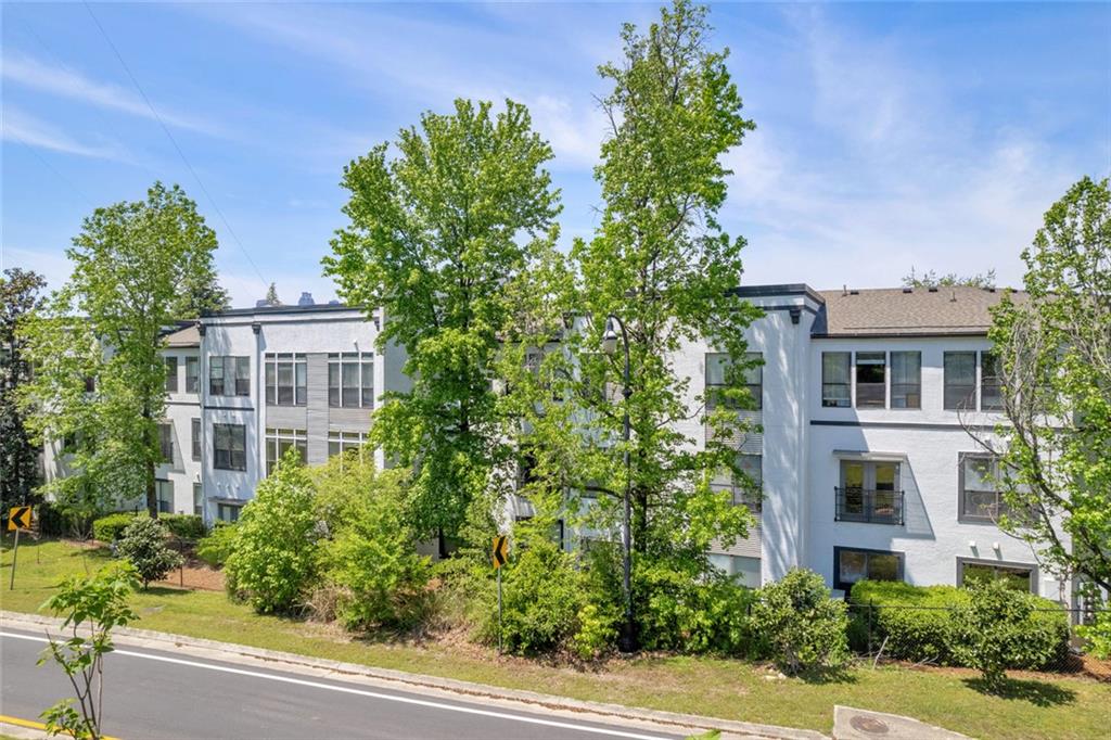 821 Ralph McGill Boulevard Northeast, Unit 3325 Atlanta, GA 30306 - Photo 42 of 54 a front view of a multi story building with yard