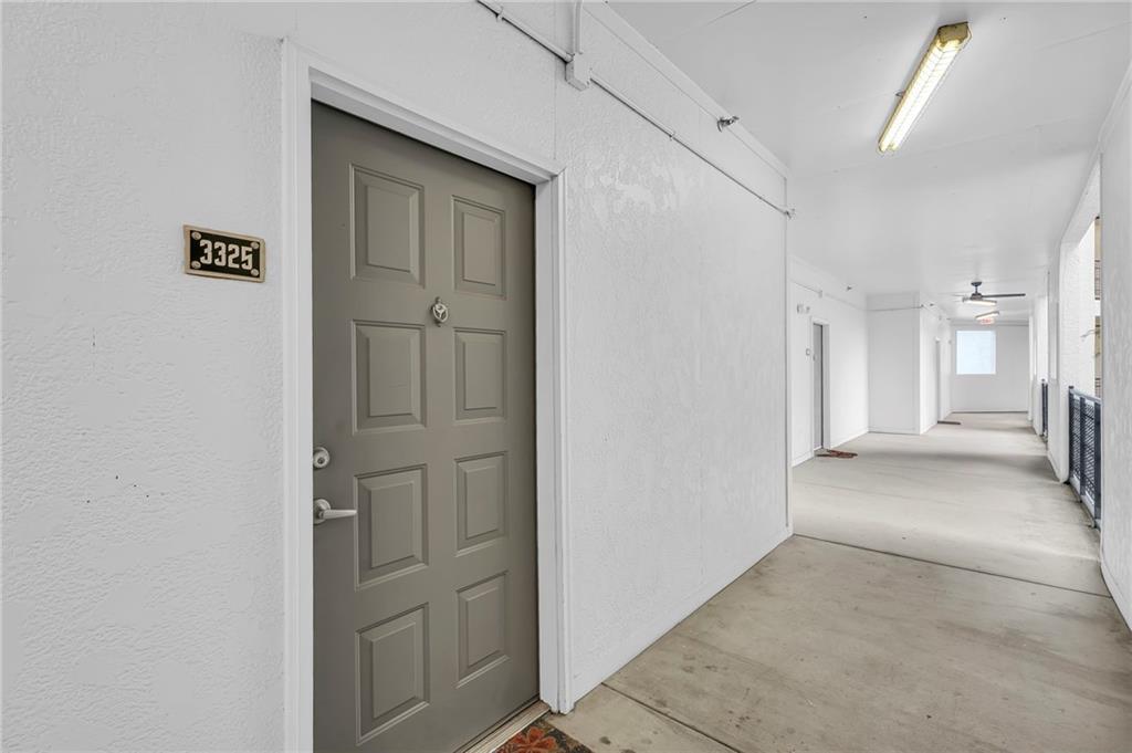 821 Ralph McGill Boulevard Northeast, Unit 3325 Atlanta, GA 30306 - Photo 6 of 54 a view of a hallway with wooden cabinet