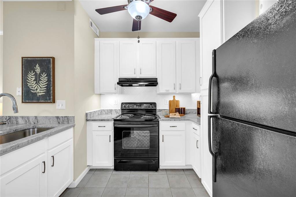 821 Ralph McGill Boulevard Northeast, Unit 3325 Atlanta, GA 30306 - Photo 8 of 54 a kitchen with a refrigerator sink and stove