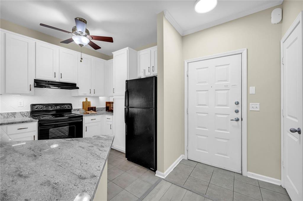 821 Ralph McGill Boulevard Northeast, Unit 3325 Atlanta, GA 30306 - Photo 9 of 54 a kitchen with stainless steel appliances a refrigerator a stove a sink and a refrigerator