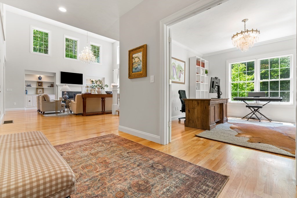 19 Village Road Pepperell, MA 01463 - Photo 12 of 41 a living room with furniture and a flat screen tv