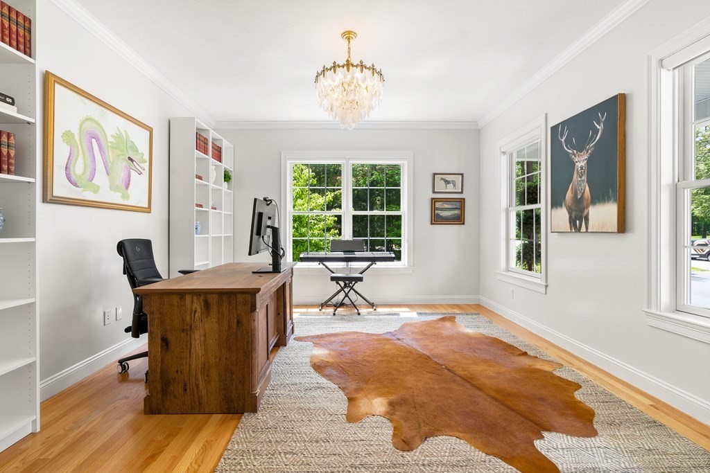 19 Village Road Pepperell, MA 01463 - Photo 13 of 41 a living room filled with furniture and a chandelier