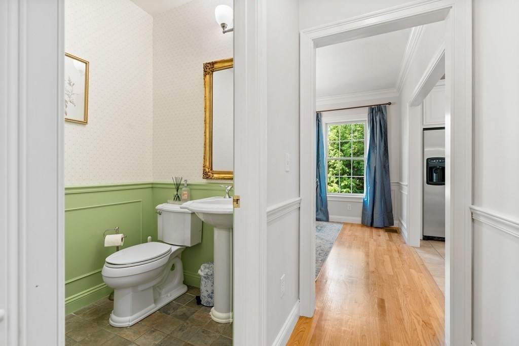 19 Village Road Pepperell, MA 01463 - Photo 14 of 41 a bathroom with a toilet sink and mirror