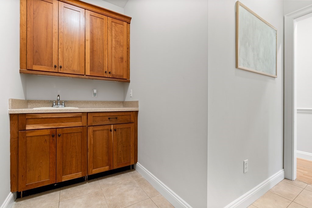 19 Village Road Pepperell, MA 01463 - Photo 15 of 41 a kitchen with stainless steel appliances granite countertop white cabinets and a sink