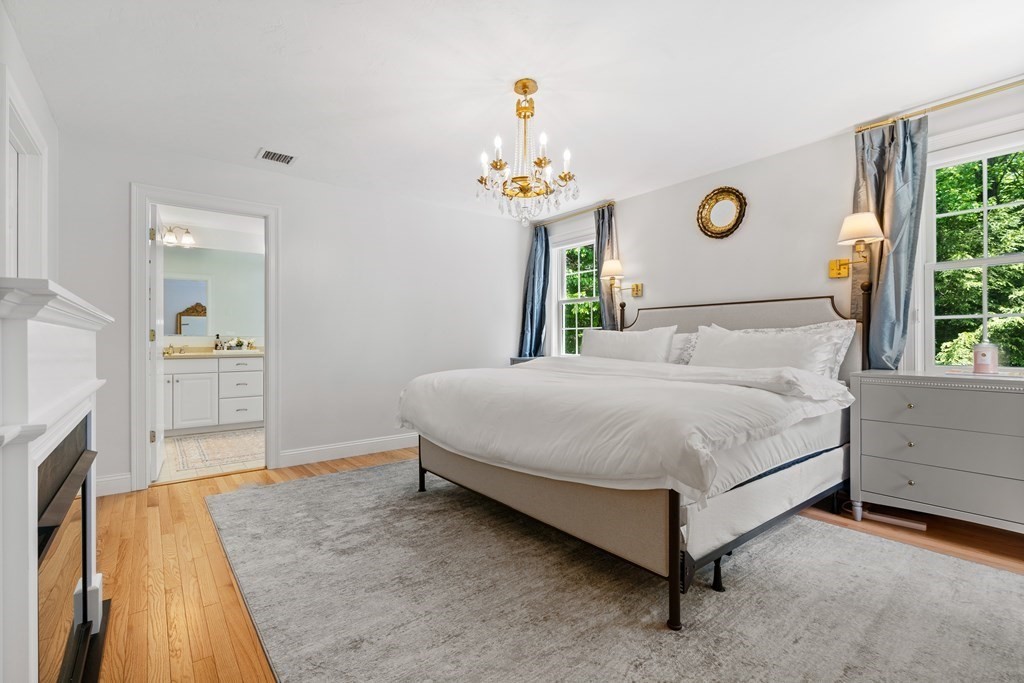 19 Village Road Pepperell, MA 01463 - Photo 17 of 41 a bedroom with a bed and a dresser