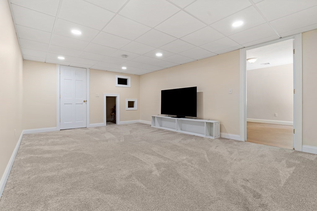 19 Village Road Pepperell, MA 01463 - Photo 29 of 41 a view of a livingroom with a flat screen tv