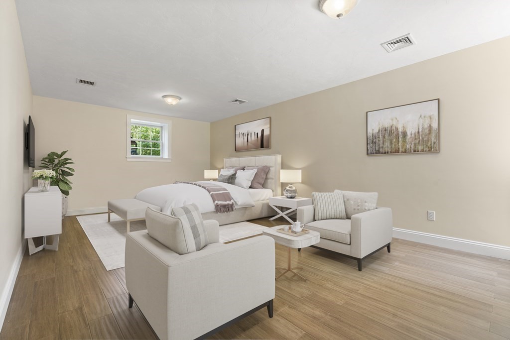 19 Village Road Pepperell, MA 01463 - Photo 30 of 41 a living room with furniture and a wooden floor