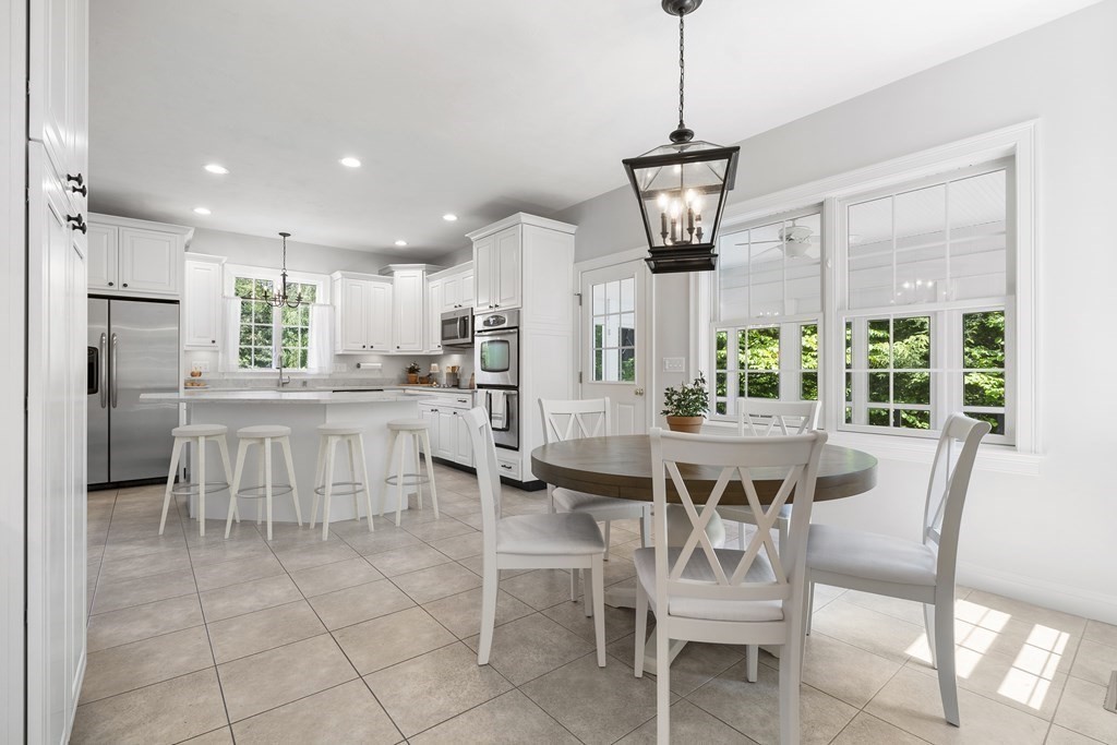 19 Village Road Pepperell, MA 01463 - Photo 3 of 41 a view of a dining room with furniture window and outside view