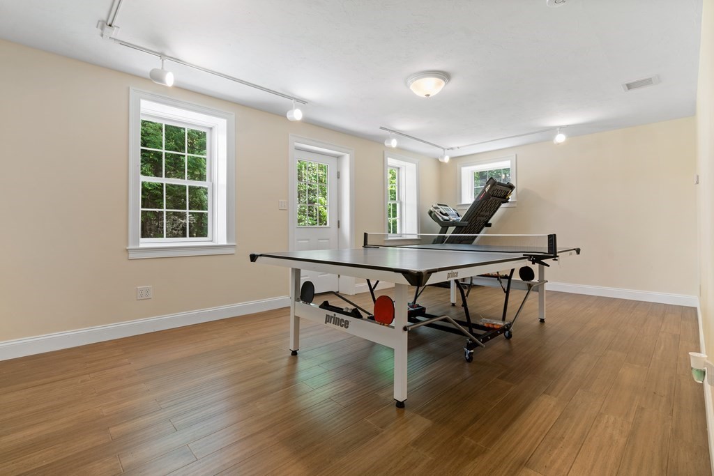 19 Village Road Pepperell, MA 01463 - Photo 31 of 41 a workspace with wooden floor and a window