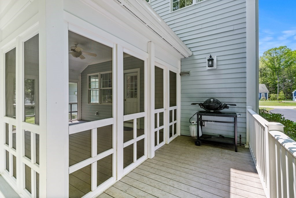 19 Village Road Pepperell, MA 01463 - Photo 32 of 41 a view of a balcony and a patio