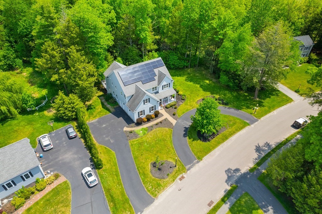19 Village Road Pepperell, MA 01463 - Photo 35 of 41 an aerial view of a house with a garden and swimming pool