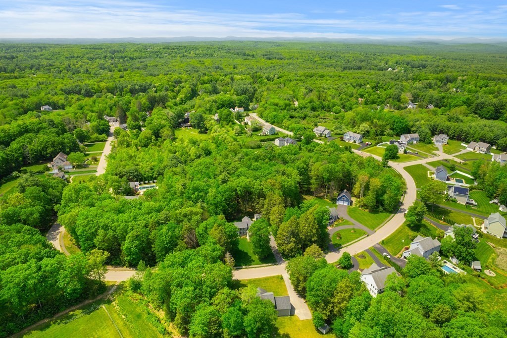 19 Village Road Pepperell, MA 01463 - Photo 37 of 41 a view of a green yard with large trees