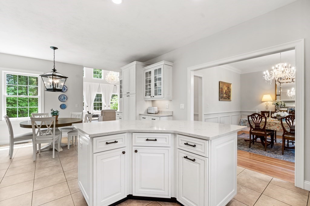 19 Village Road Pepperell, MA 01463 - Photo 6 of 41 a large white kitchen with cabinets