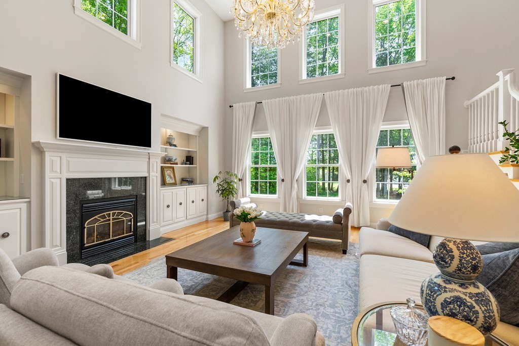 19 Village Road Pepperell, MA 01463 - Photo 9 of 41 a living room with furniture fireplace and flat screen tv
