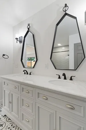 a view of mirror with vanity and mirror