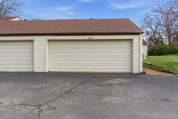 a small yard with a table and chair