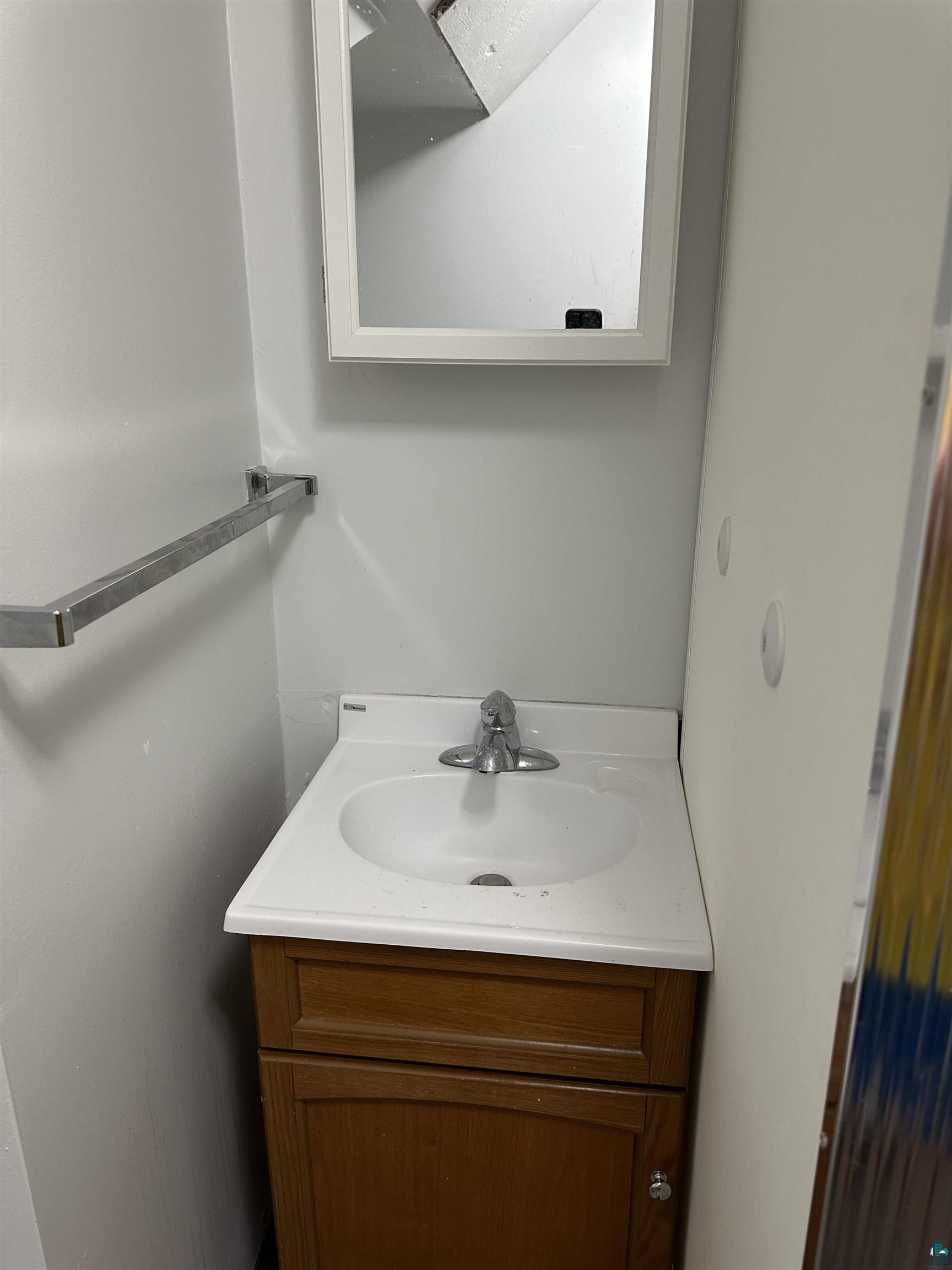 2309 Anderson Road Duluth, MN 55811 - Photo 26 of 36 Lower level bathroom sink and mirror area.
