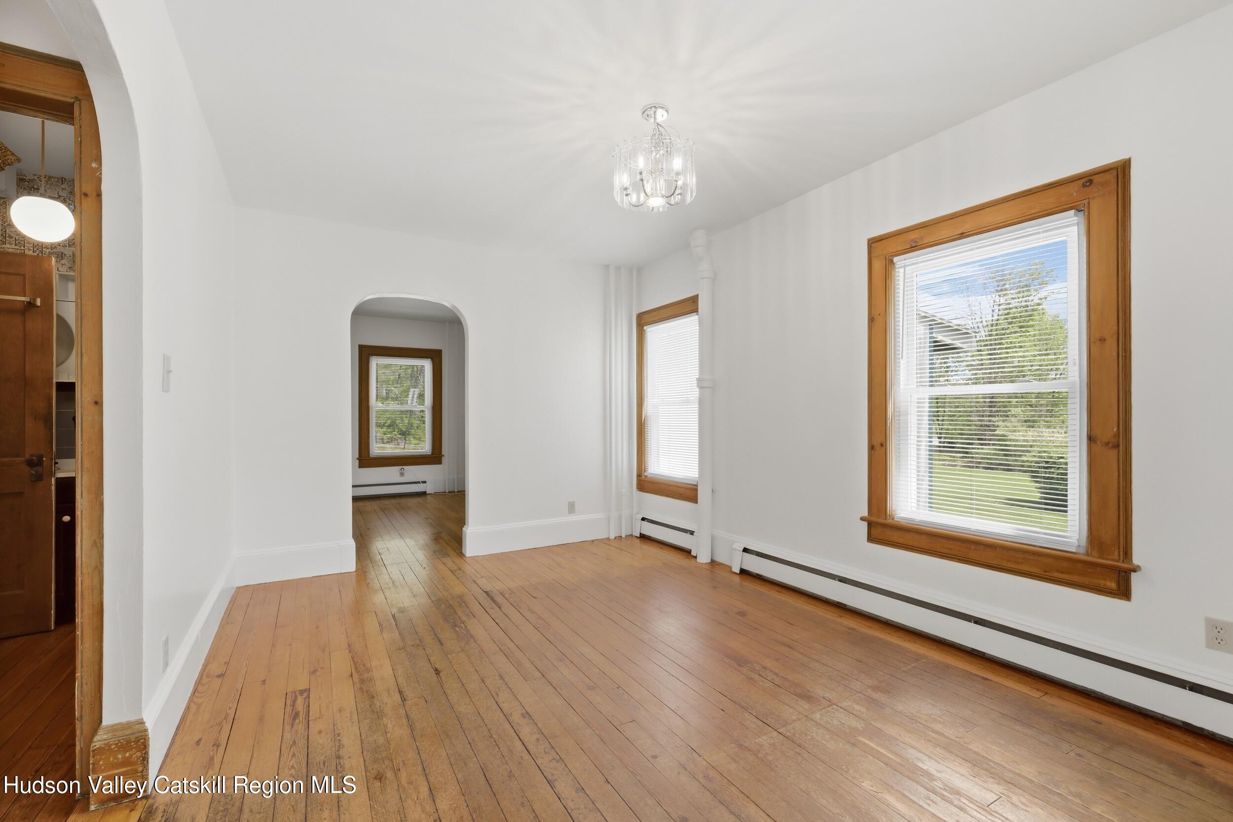 294 Kyserike Road Accord, NY 12404 - Photo 17 of 46 an empty room with wooden floor and windows