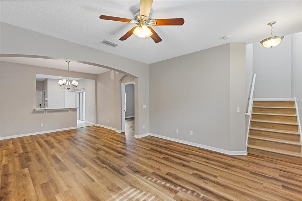 506 Rainbow Springs Loop Groveland, FL 34736 - Photo 3 of 30 a view of empty room with wooden floor