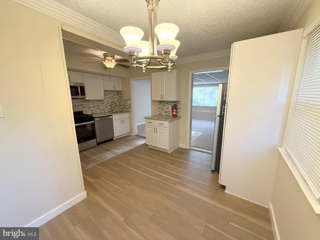 a view of a kitchen with a sink and dishwasher kitchen view