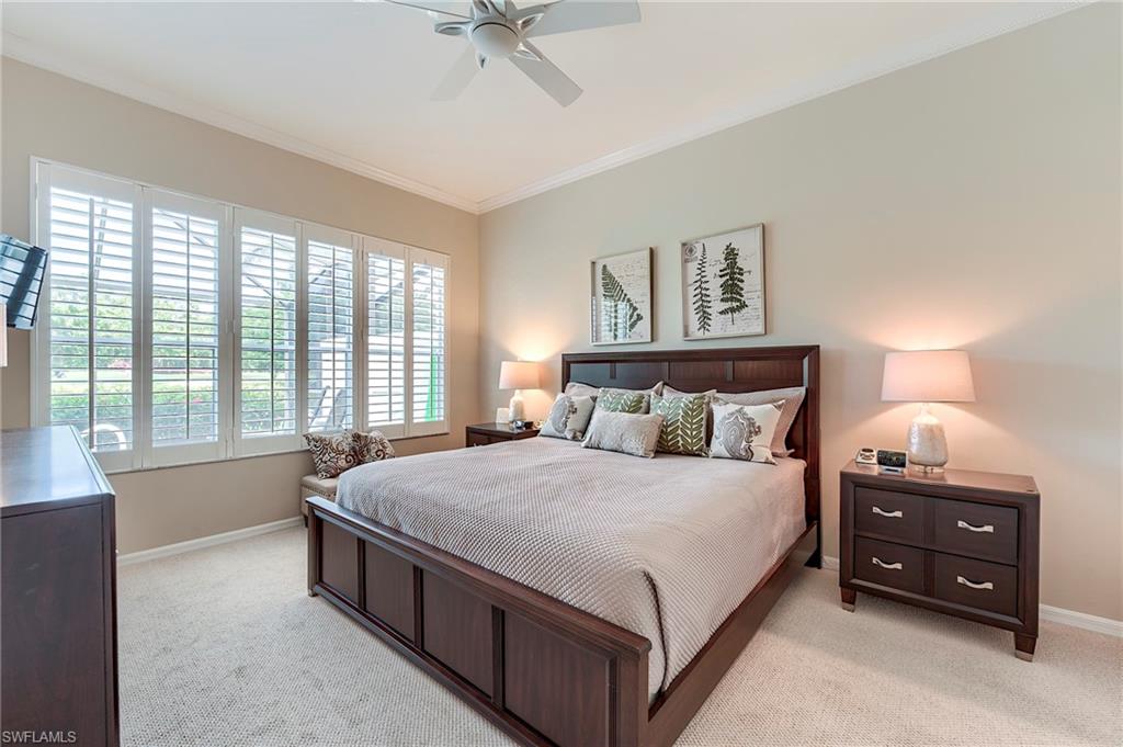 9296 Spring Run Boulevard Estero, FL 34135 - Photo 14 of 38 a large bed sitting in a bedroom next to a window
