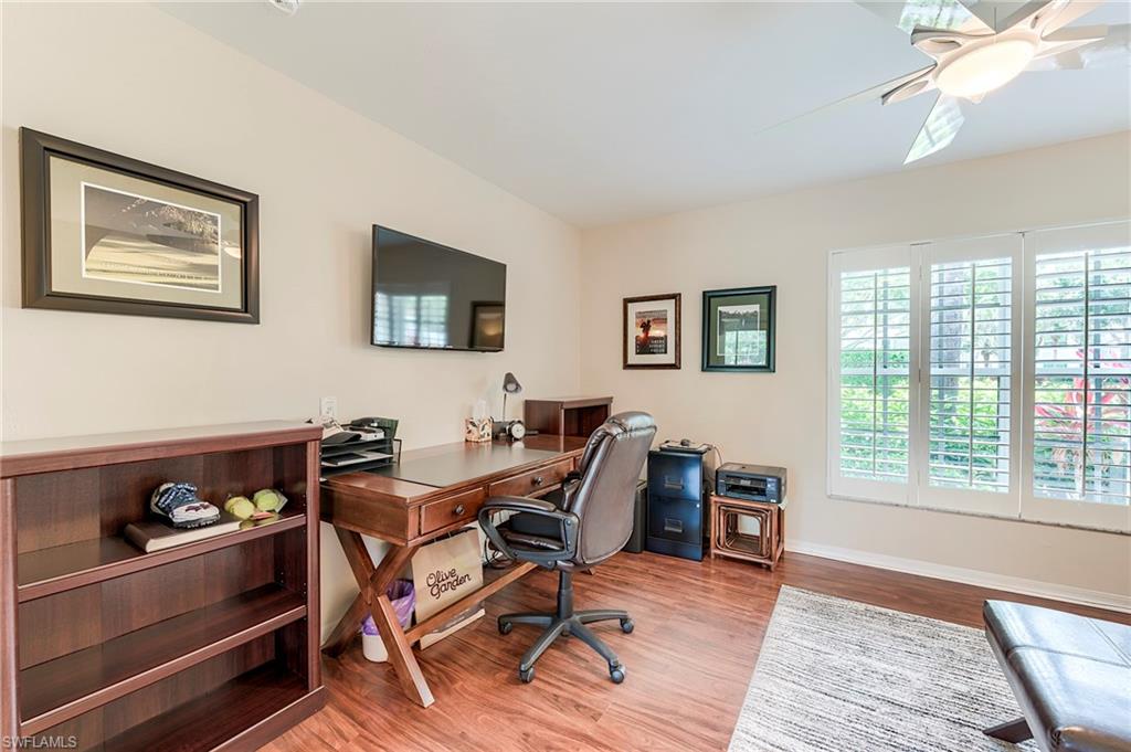 9296 Spring Run Boulevard Estero, FL 34135 - Photo 17 of 38 a workspace with wooden floor