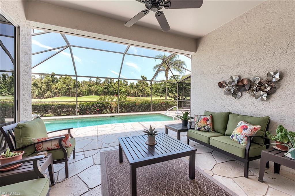 9296 Spring Run Boulevard Estero, FL 34135 - Photo 2 of 38 a living room with furniture and a large window