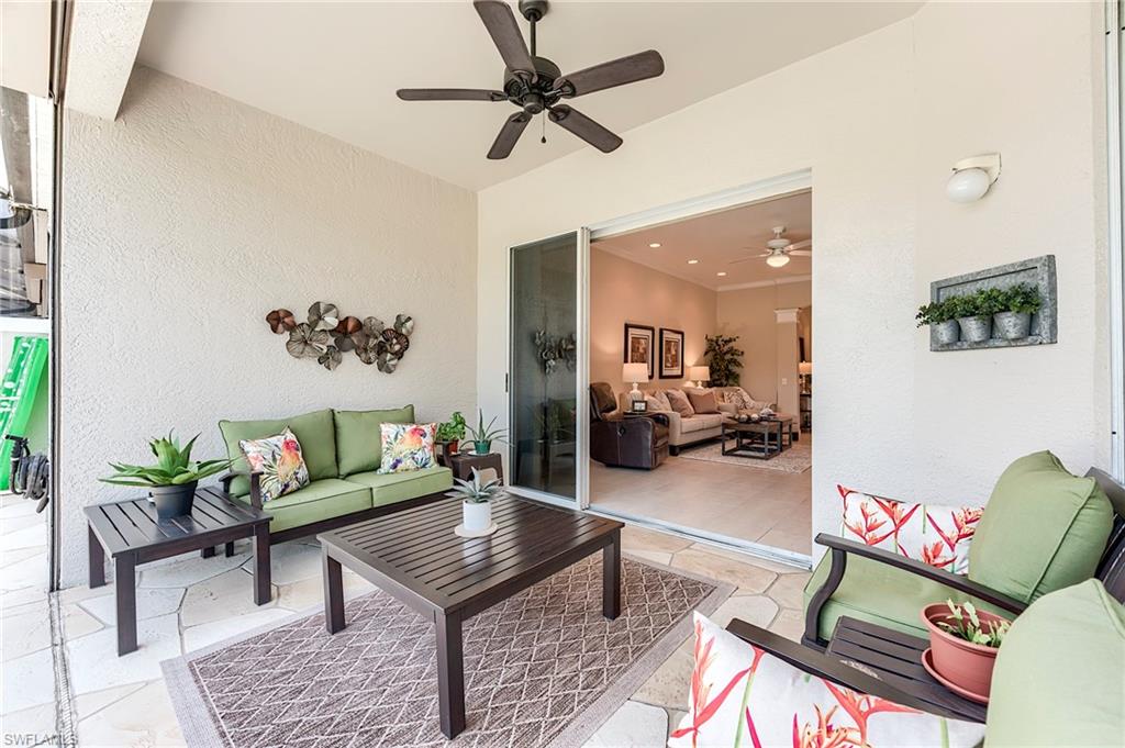 9296 Spring Run Boulevard Estero, FL 34135 - Photo 21 of 38 a living room with furniture