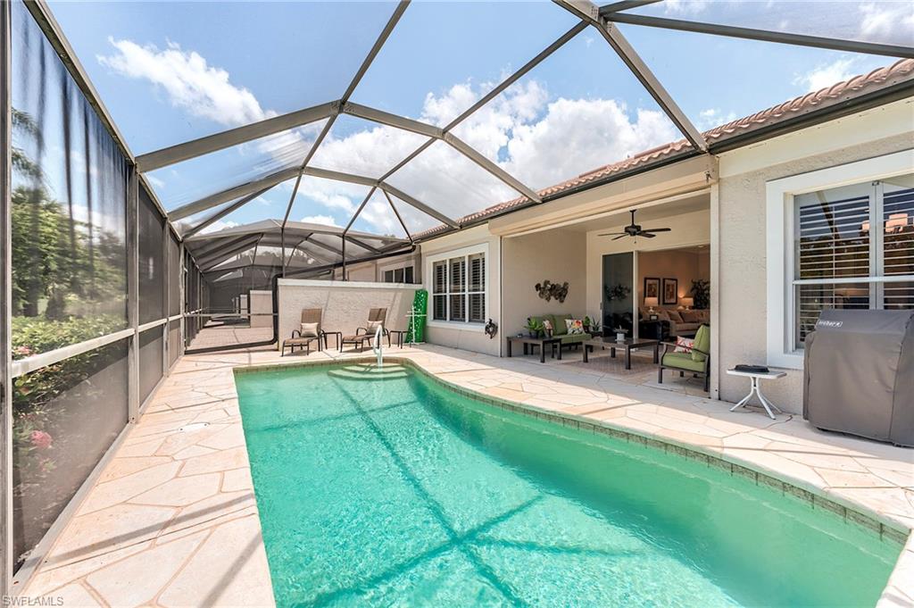 9296 Spring Run Boulevard Estero, FL 34135 - Photo 23 of 38 a view of swimming pool with seating area