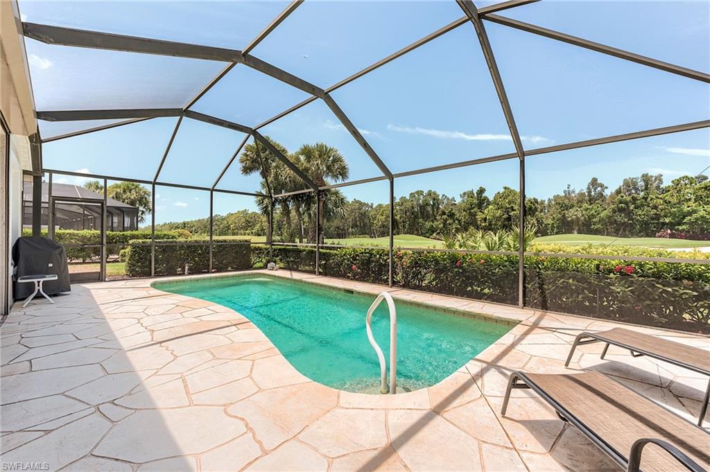 9296 Spring Run Boulevard Estero, FL 34135 - Photo 25 of 38 a view of a swimming pool with a porch