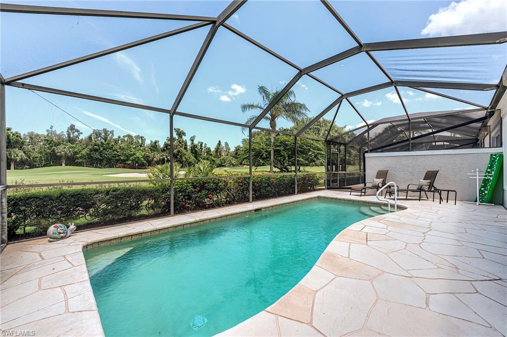 9296 Spring Run Boulevard Estero, FL 34135 - Photo 26 of 38 a view of a backyard of the house