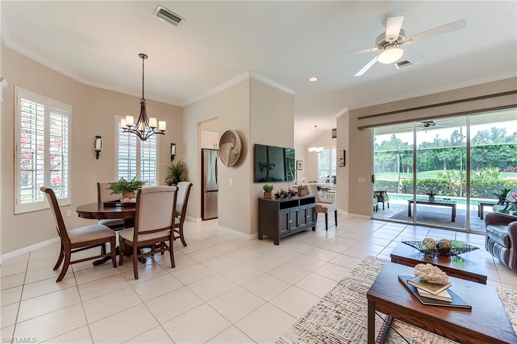 9296 Spring Run Boulevard Estero, FL 34135 - Photo 3 of 38 a view of a dining room with furniture window and outside view