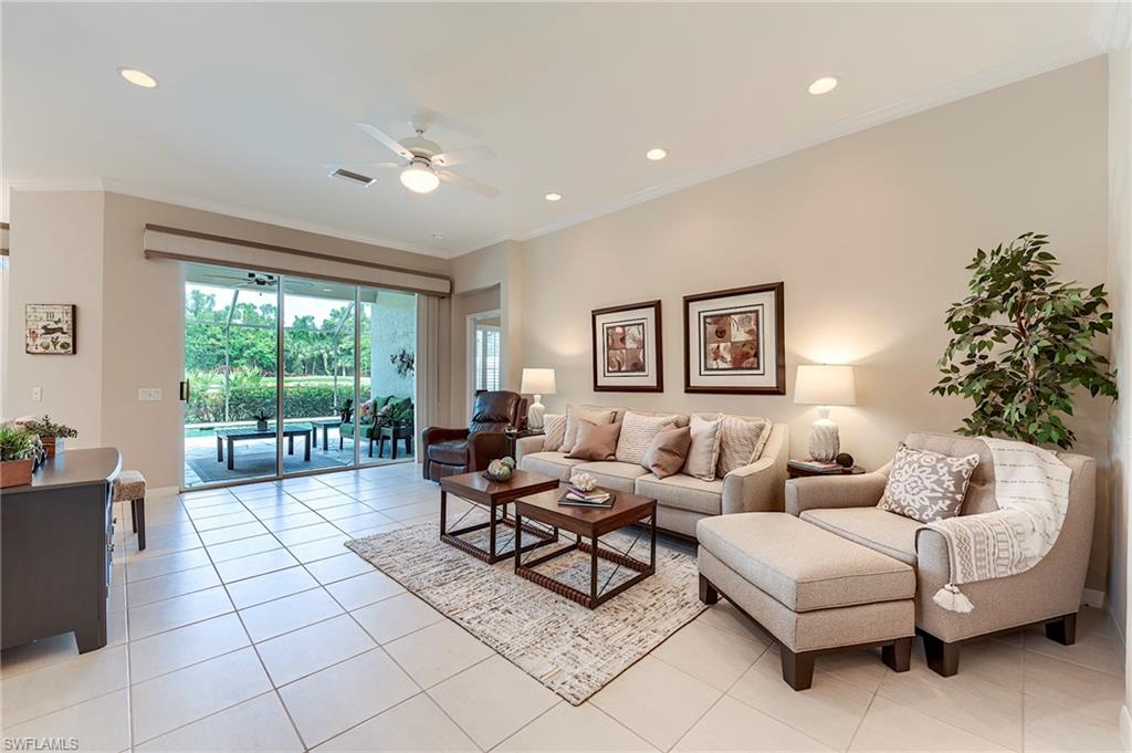 9296 Spring Run Boulevard Estero, FL 34135 - Photo 4 of 38 a living room with furniture and a large window