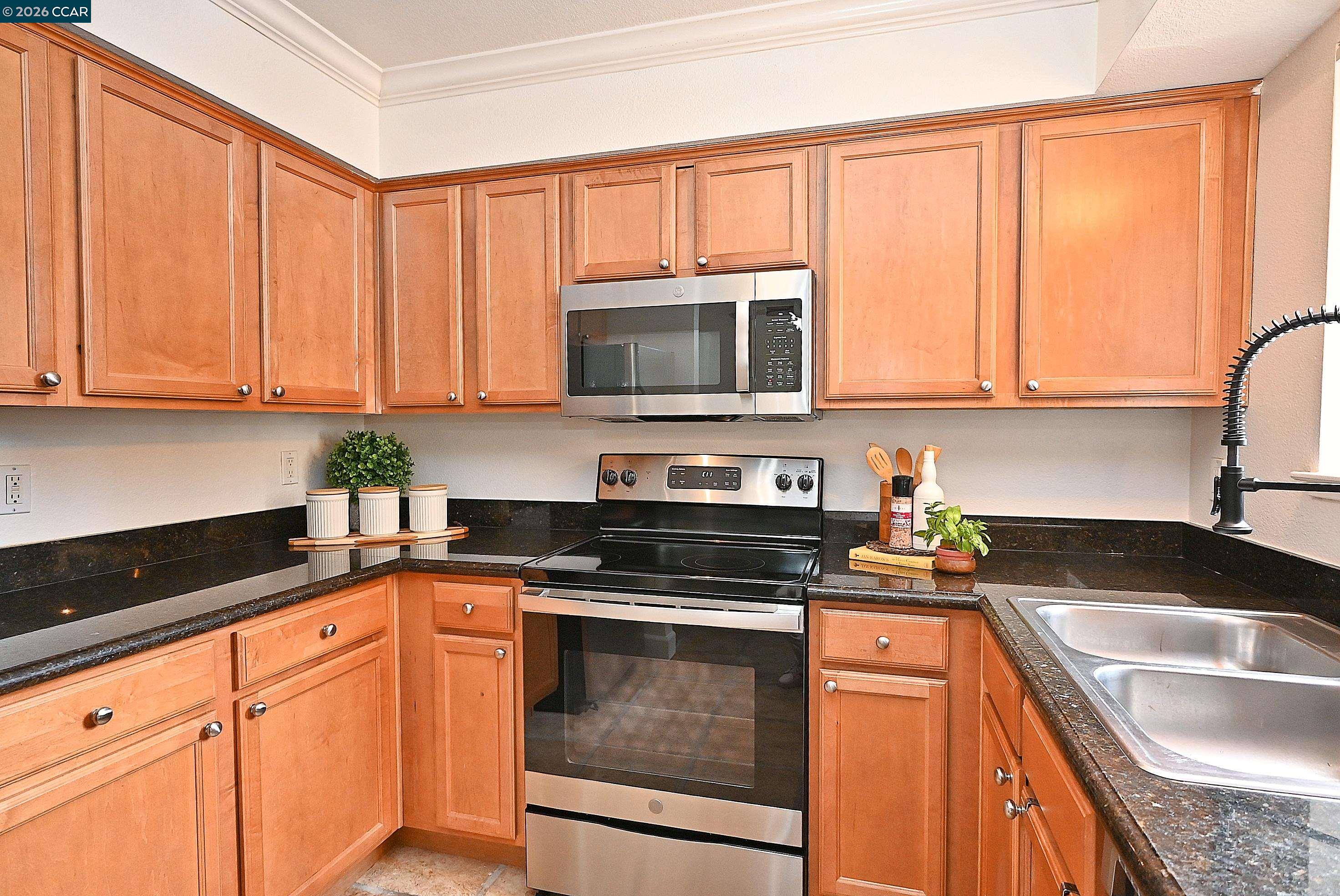 182 Eastridge Drive San Ramon, CA 94582 - Photo 15 of 47 a kitchen with granite countertop cabinets stainless steel appliances and a sink