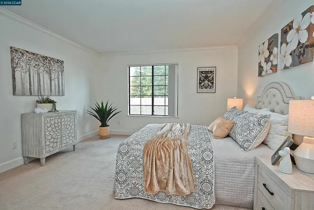 a bedroom with bed and a window