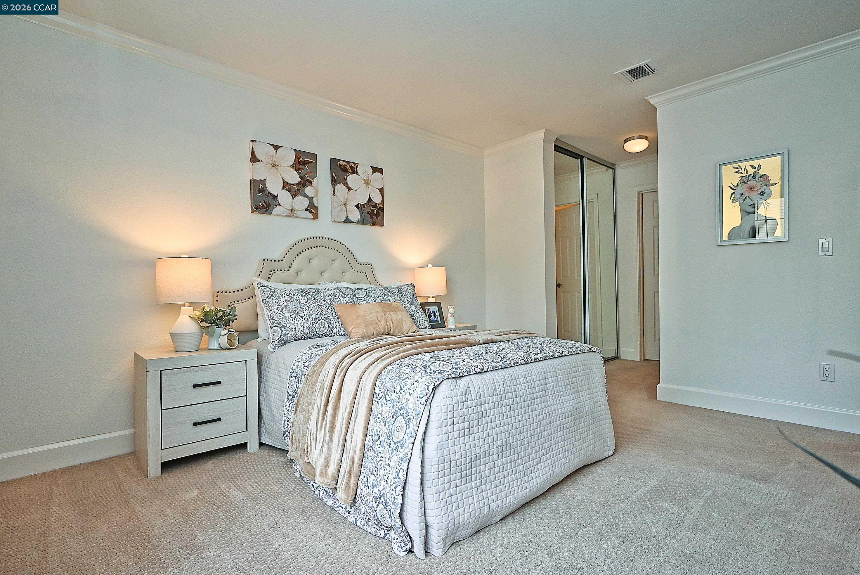 182 Eastridge Drive San Ramon, CA 94582 - Photo 19 of 47 a bedroom with a bed and a lamp on the dresser