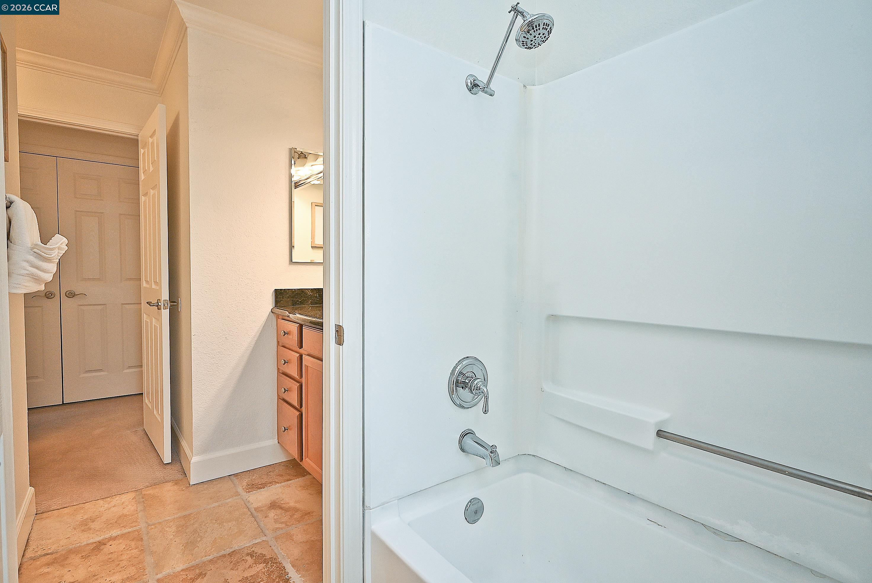 182 Eastridge Drive San Ramon, CA 94582 - Photo 23 of 47 a bathroom with a tub and shower