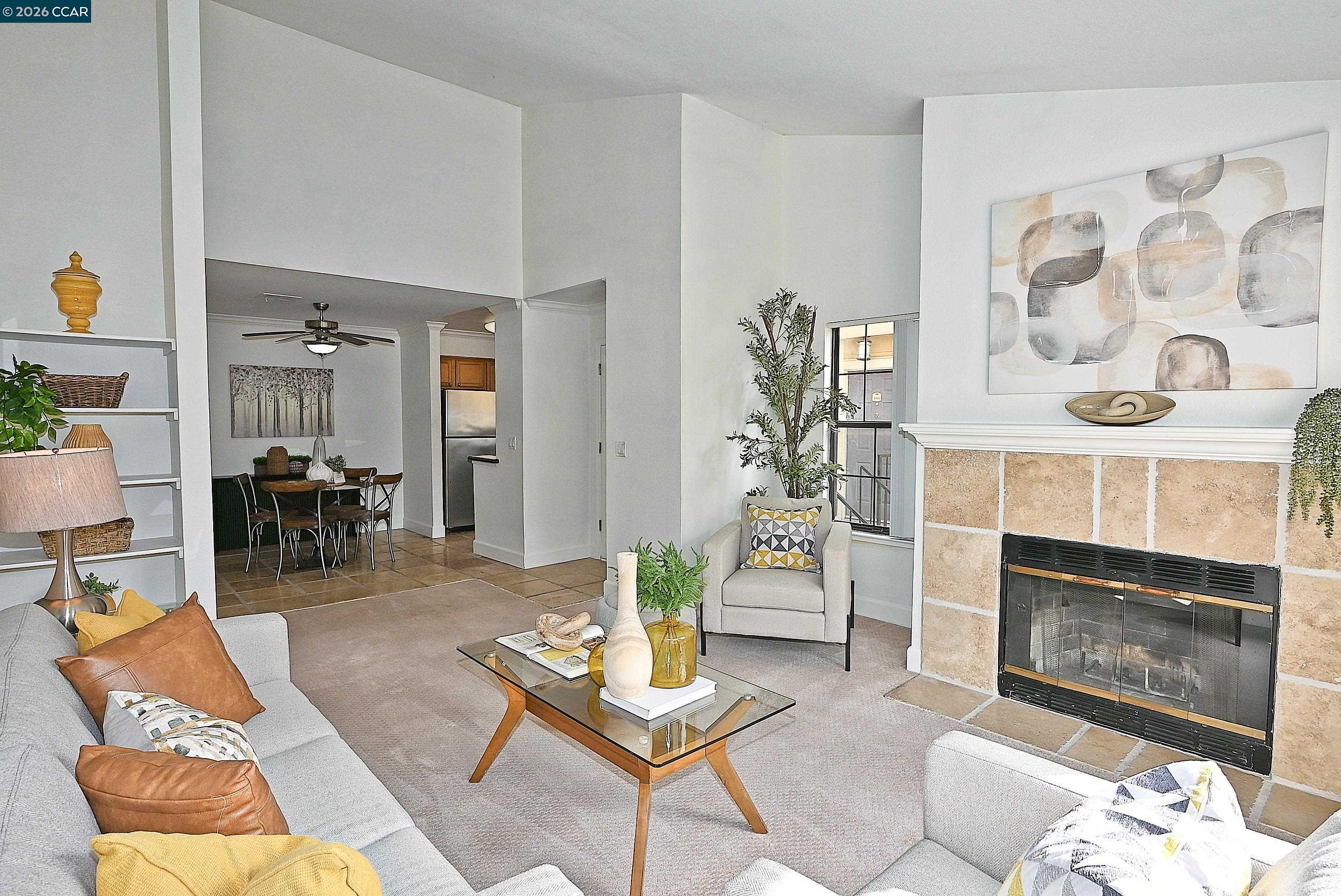 182 Eastridge Drive San Ramon, CA 94582 - Photo 5 of 47 a living room with furniture a dining table and a fireplace